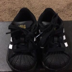 Brand new black&white adidas. Toddler size 4
